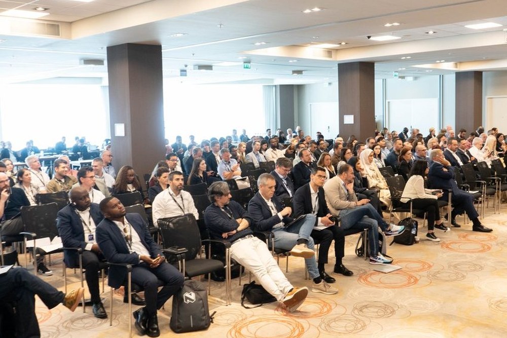 A large seated audience filling a bright conference room at a previous Excellence in Digital Banking summit